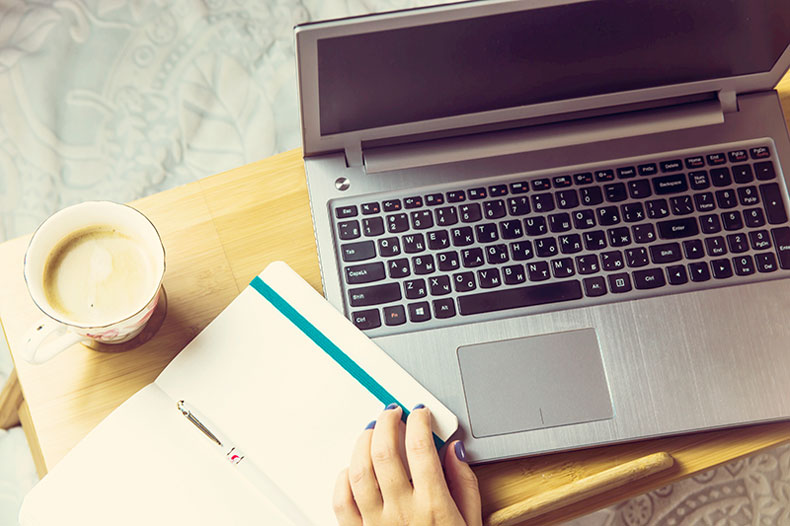 laptop on a lap desk or tray